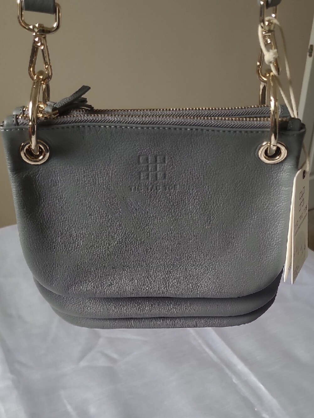 Structured Gray Crossbody Bag with Gold Eyelet Detail